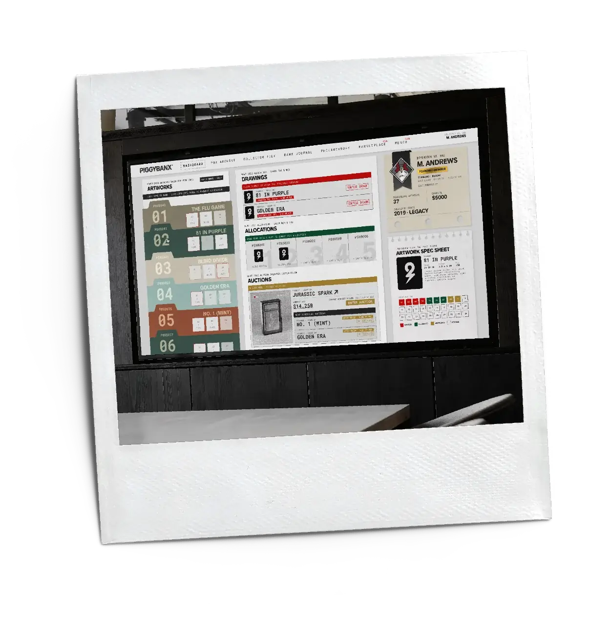 A monitor showing the PiggyBanx collection dashboard
